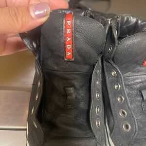Prada Black Leather Sneakers with Red Accents